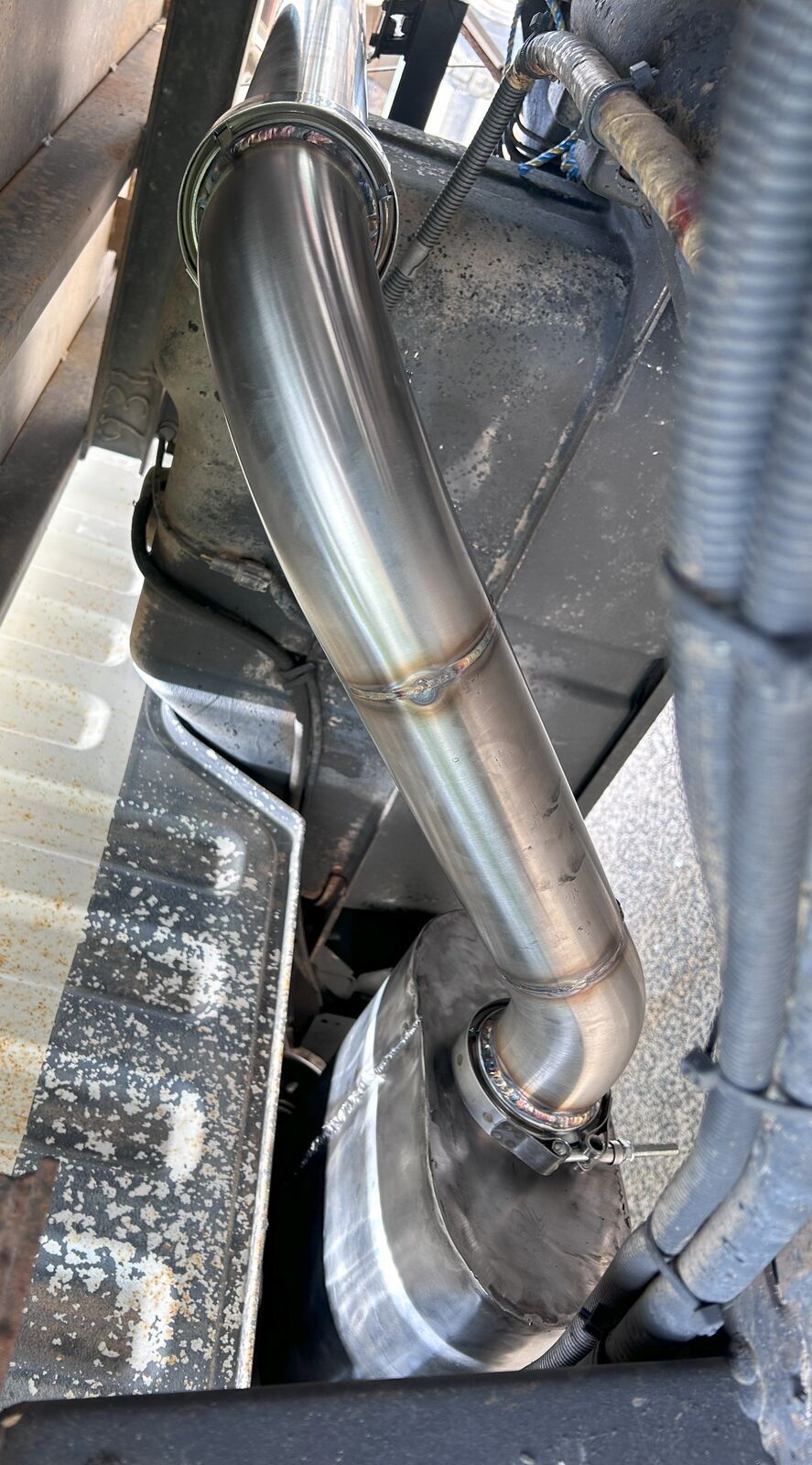 Stainless exhaust under vehicle